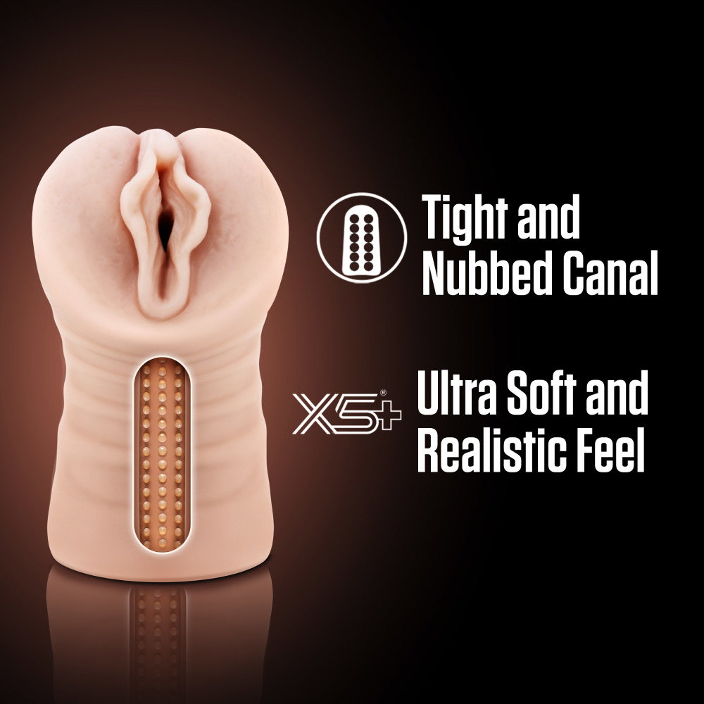 EnLust Destini vibrating stroker in flesh colour, compact open-ended masturbator