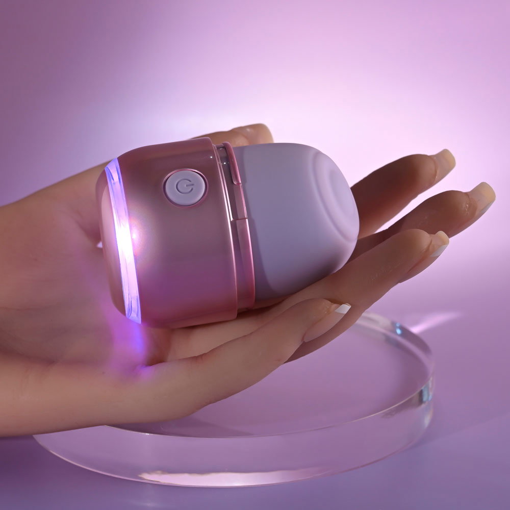 Evolved Vacation Vibes tapping stimulator, pink-pearl iridescent canister-style toy with silicone head