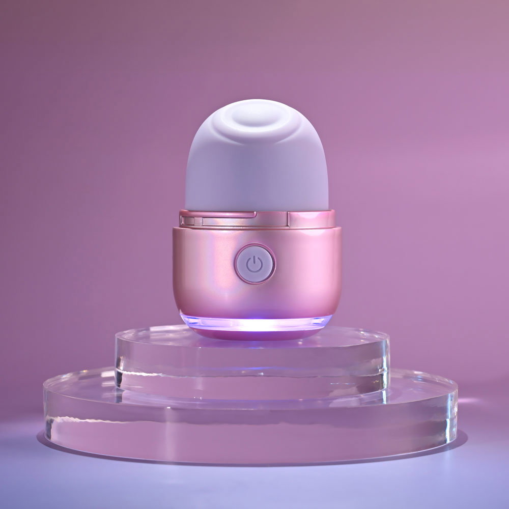 Evolved Vacation Vibes tapping stimulator, pink-pearl iridescent canister-style toy with silicone head