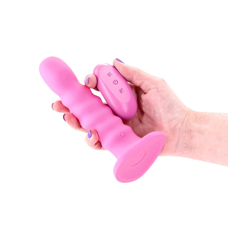 Pink ribbed silicone vibrating dildo with suction cup base and wireless remote control