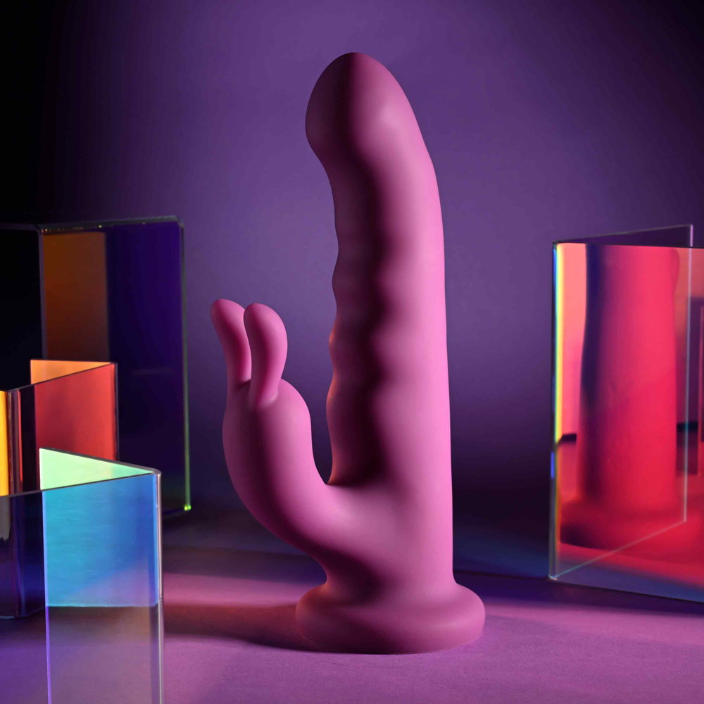 Playboy Pleasure Fluffle silicone rabbit vibrator with twirling shaft, bunny ears and suction cup base