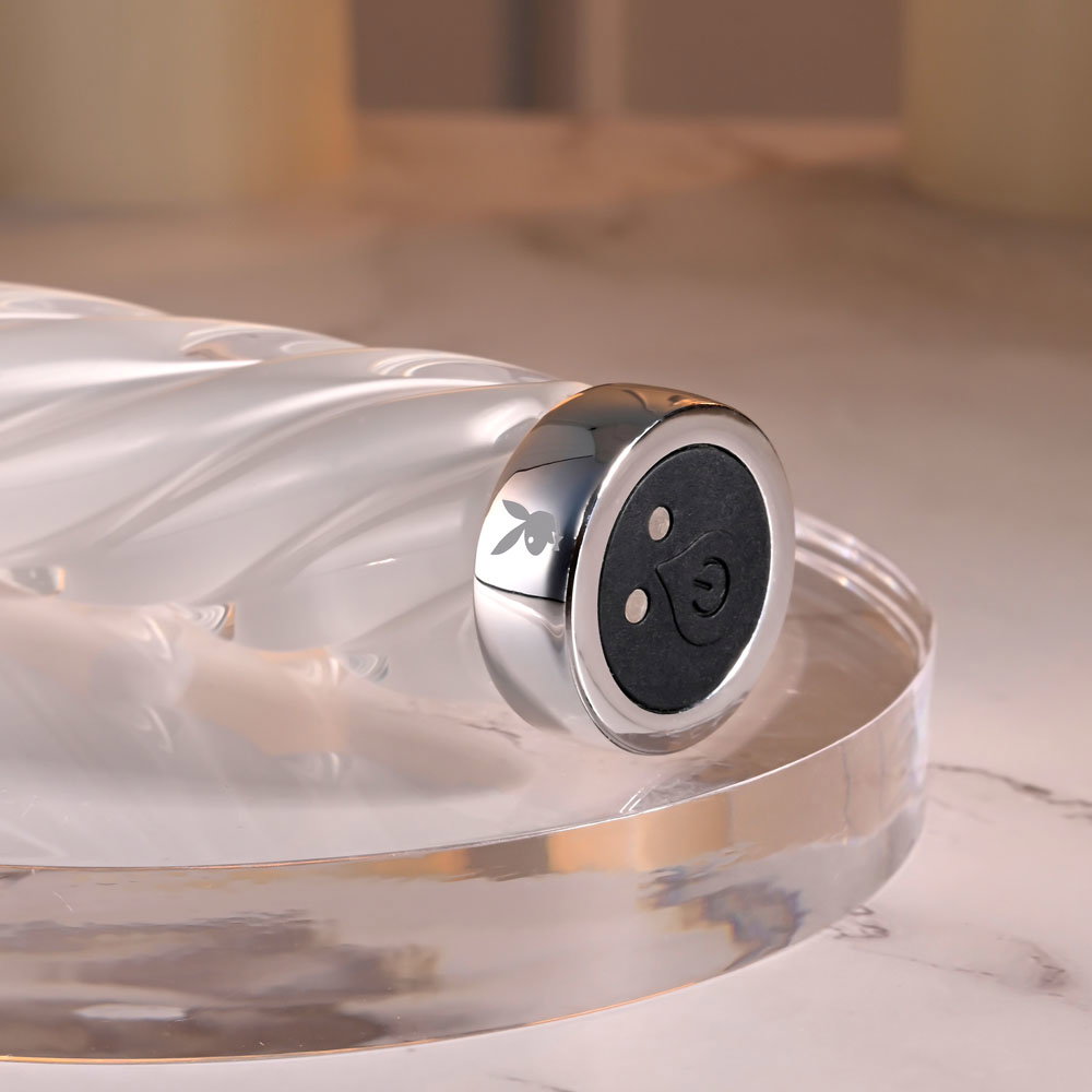 Playboy Pleasure In A Twist white glass vibrator with spiral texture and tapered tip