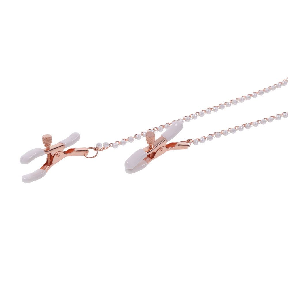 Peach faux leather bondage collar with rose gold hardware and attached nipple clamps