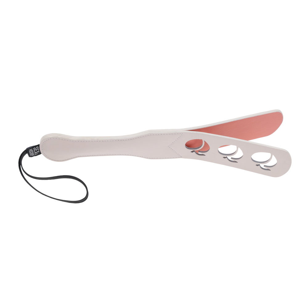 Sportsheets Peaches n CreaMe faux leather paddle with peach-shaped cut outs and wrist strap